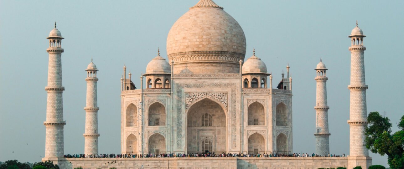 A stunning shot of the Taj Mahal in Agra, showcasing its iconic architecture and serene surroundings.