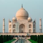 A stunning shot of the Taj Mahal in Agra, showcasing its iconic architecture and serene surroundings.