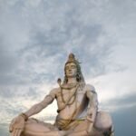 Majestic sculpture of Lord Shiva meditating in Rishikesh, India, captured during twilight.