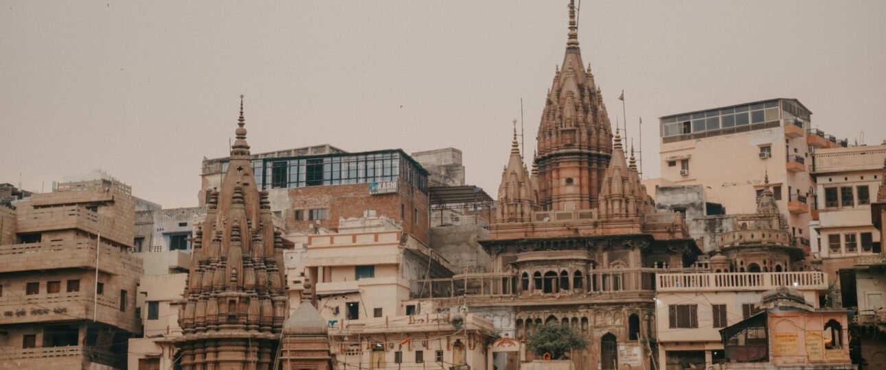 Historic temples along the Ganges River in Varanasi, showcasing spiritual and architectural beauty.